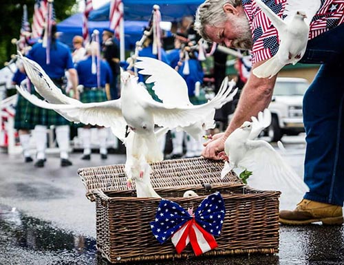 flags and a dove release